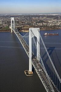 Aerial view of New York City's Verrazano-Narrow's bridge with tanker ship in water