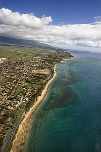 Aerial of Maui, Hawaii coastline with beach and buildings