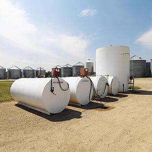 Fuel tanks labeled unleaded and ethanol and pumps