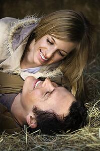 Couple lying in hay