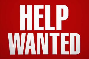 Red help wanted sign.