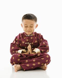 Boy sitting meditating