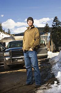 Man standing in front of truck 