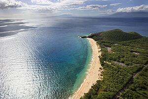 Aerial of coastline with sandy beach and Pacific ocean in Maui, Hawaii