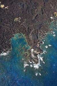 Aerial of Maui, Hawaii coastline with lava rocks.