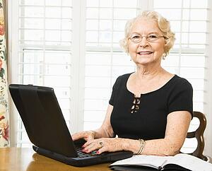 Woman using laptop in living room
