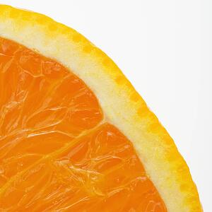 Close up of halved orange against white background.