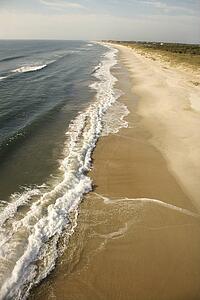 Waves crashing on beach on Bald Head Island, North Carolina