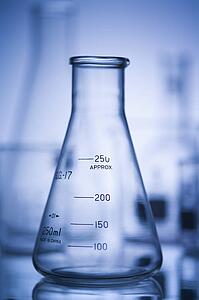 Glass science containers with blue tint.