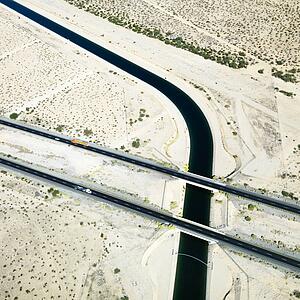 Aerial of interstate 10 highway crossing over Colorado River Aqueduct in Arizona.
