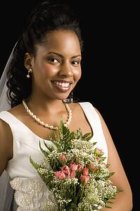 Portrait of a bride on black background
