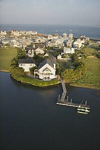 Aerial view of houses and ocean at Bald Head Island, North Carolina.