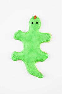 Sugar cookie in shape of lizard with decorative icing.