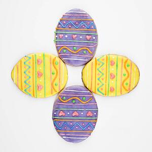 Four Easter egg sugar cookies with decorative icing.