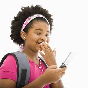 Girl with backpack talking on cell phone