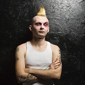 Male punk with his arms crossed