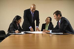 Businesspeople having meeting at conference table