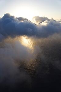 View from above the clouds with Pacific ocean below