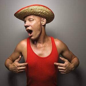 Male wearing straw hat and touching his chest.
