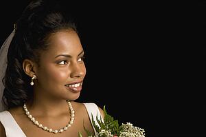 Portrait of bride holding bouquet.