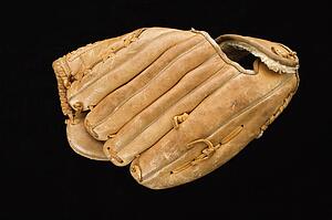 Baseball glove on black.