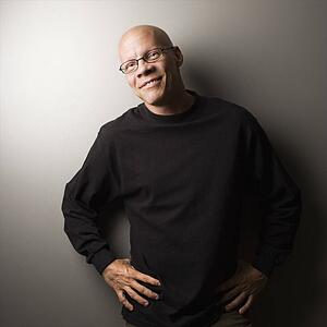 Portrait of mid-adult male with hands on hips