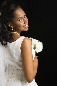 Portrait of a bride on black background