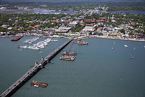 Aerial view of ships and boats in water with Bridge of Lions in Saint Augustine, Florida. 