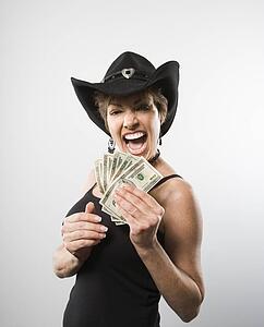 Woman holding twenty dollar bills 