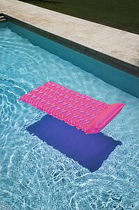 Pink lounge float in empty swimming pool.