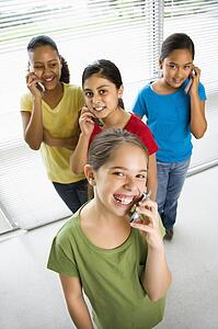 Girls talking on cell phones