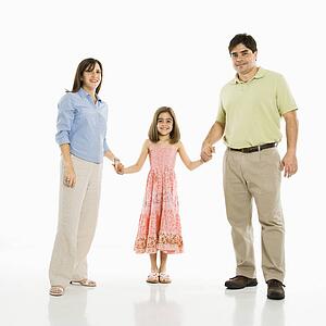Parents and daughter holding hands 