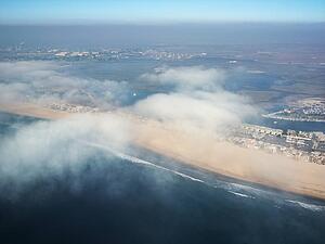 Aerial view of clouds covering beachfront in Southern California