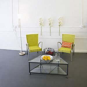 Contemporary arm chairs and coffee table inside room.