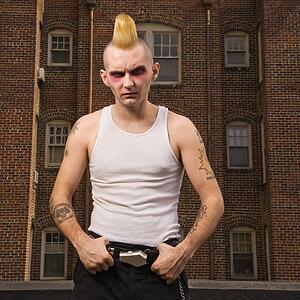 Punk outside with building in background
