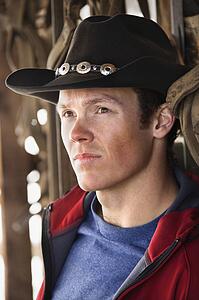 Young man wearing cowboy hat