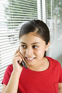Young girl talking on cell phone