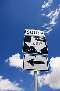 Highway sign denoting south Texas farm road with arrow