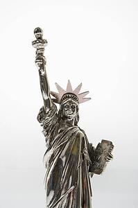 Statue of Liberty reproduction on white background.