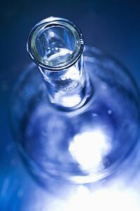 Glass science container with blue tint.