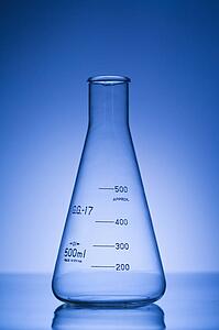 Glass science container with blue tint.