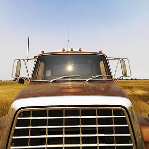 Front view of farm truck in field.
