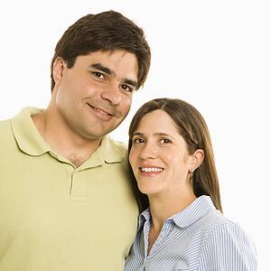 Portrait of smiling couple against white background