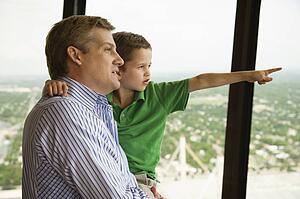 Father and son at observation deck at Tower of the Americas in San Antonio, Texas