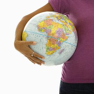 Arm and hips woman holding globe
