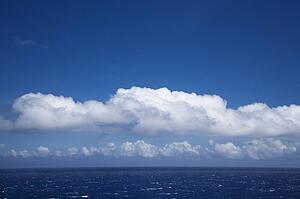 Pacific ocean with white puffy clouds