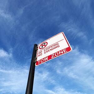 No parking tow zone street sign.