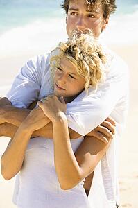 Couple embracing on Maui, Hawaii beach