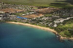 Aerial of Maui, Hawaii coastline with buildings and beach