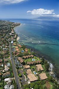 Aerial view of buildings on coastline of Maui, Hawaii.